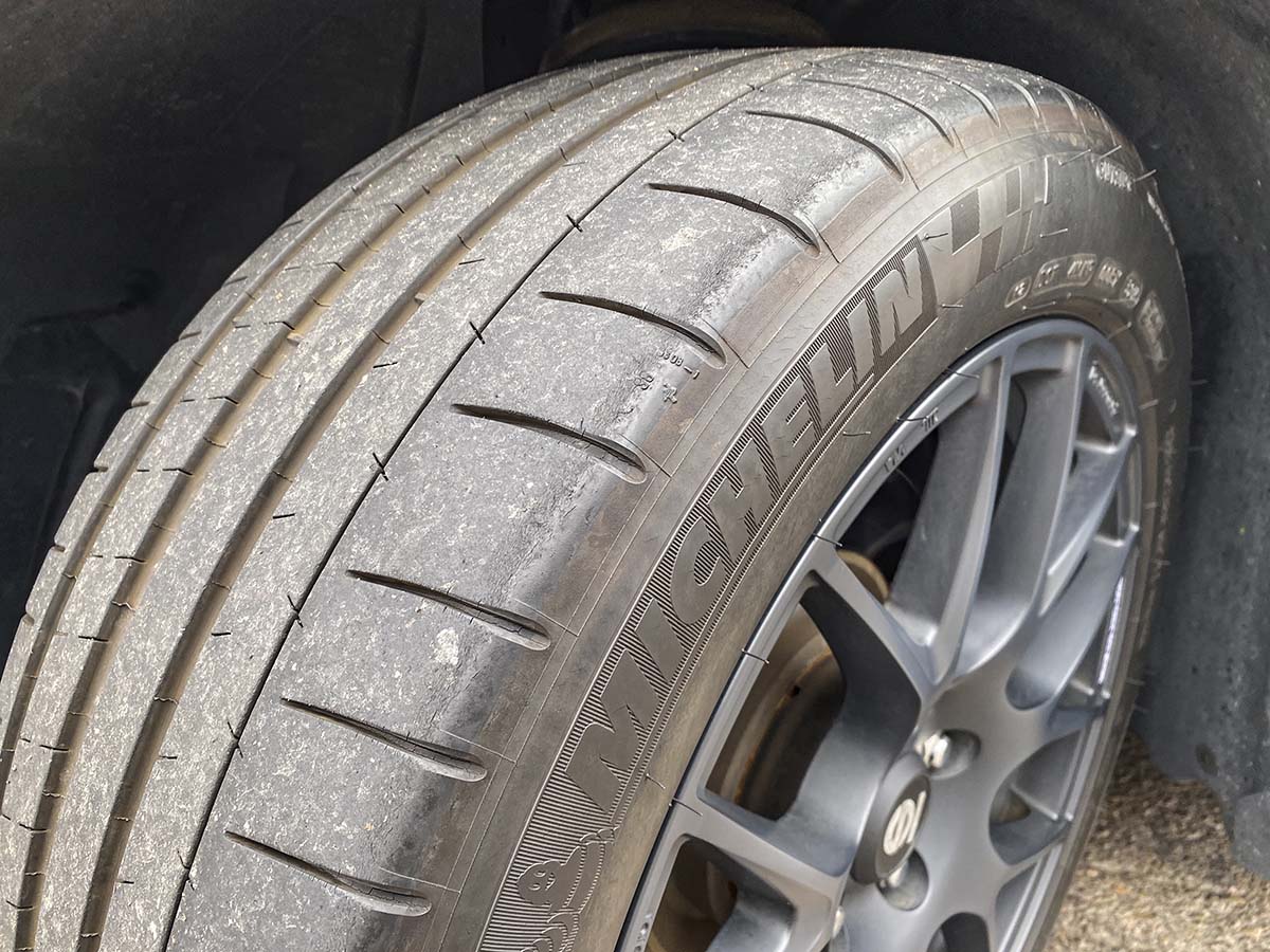 Michelin pilot Super Sport tires close up showing treadwear and dry rot