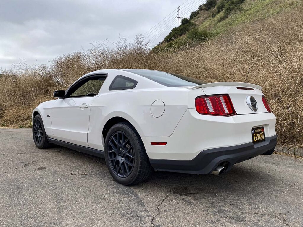 Michelin pilot Super Sport tires on a white 2012 Ford mustang GT with black wheels