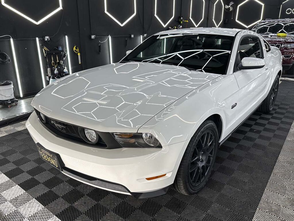 White 2012 Ford Mustang GT paint correction during a full detail