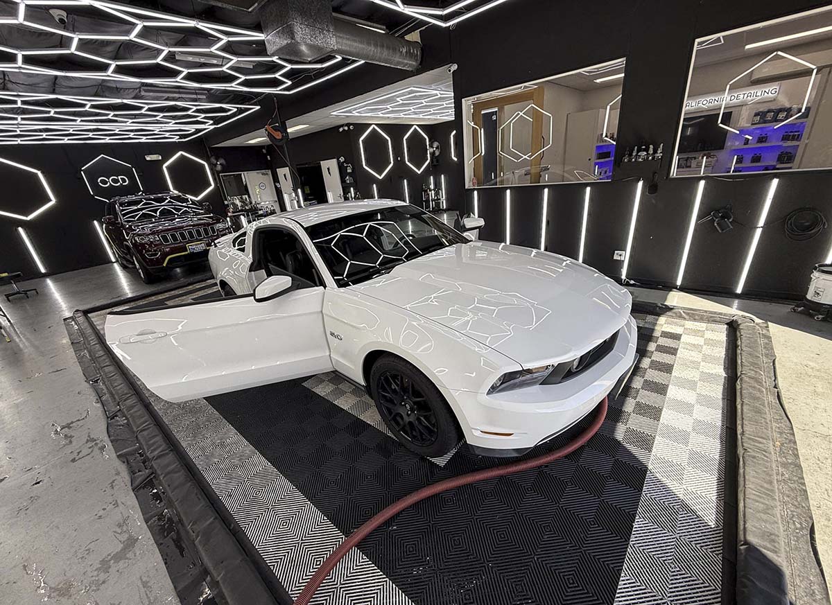 White 2012 Ford Mustang GT getting detailed
